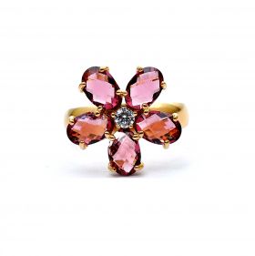 Gold ring with white zircons and rhodolite