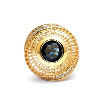 Yellow gold ring with blue topaz and zircons