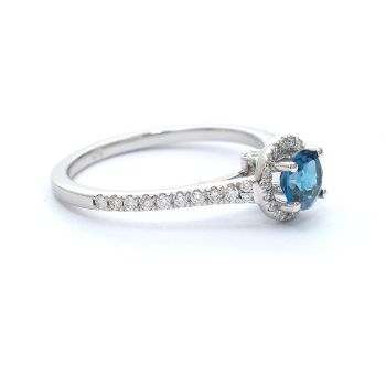 White gold ring with diamonds 0.25 ct and blue topaz 0.63 ct