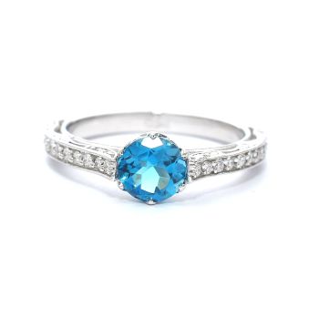 White gold ring with diamonds 0.24 ct and blue topaz 0.87 ct
