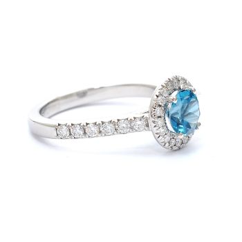 White gold ring with diamonds 0.43 ct and blue topaz 1.04 ct