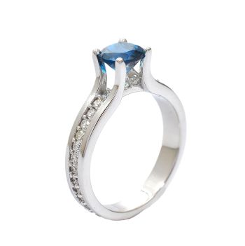 White gold ring with diamonds 0.44 ct and blue topaz 1.06 ct